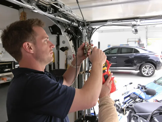 New Britain Garage Door Repair safety certified technician performing cable replacement in New Britain
