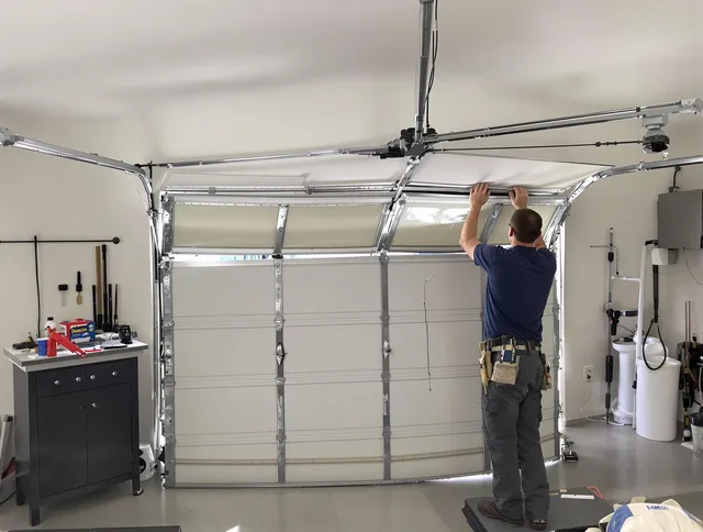 New Britain Garage Door Repair specialist performing precise section replacement on New Britain garage door